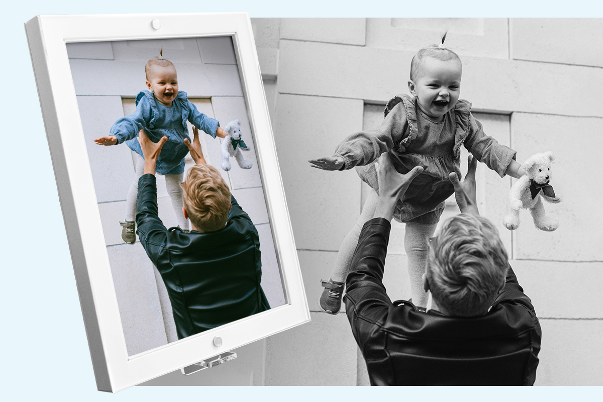 Cheerful bearded father having fun with his little son