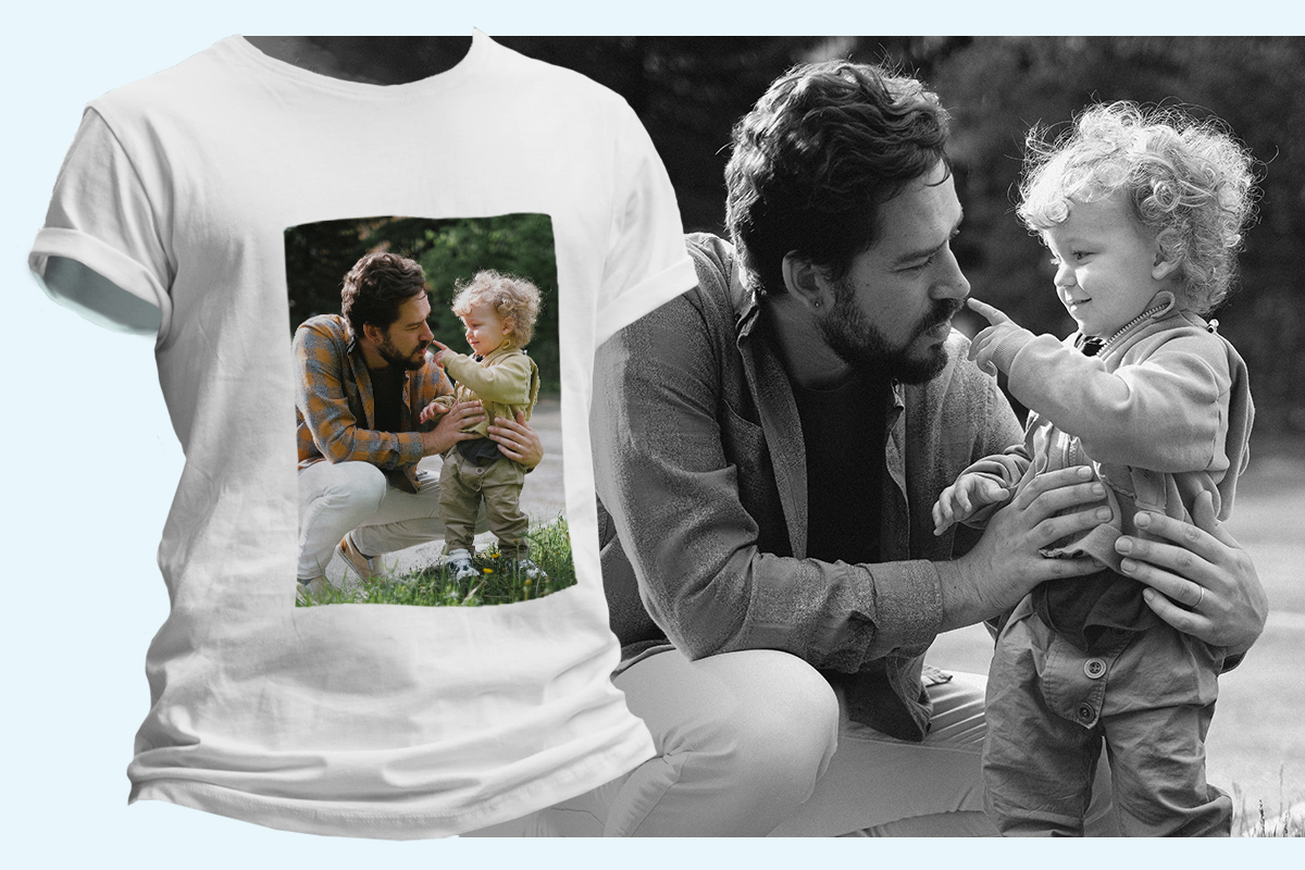 Cheerful bearded father having fun with his little son